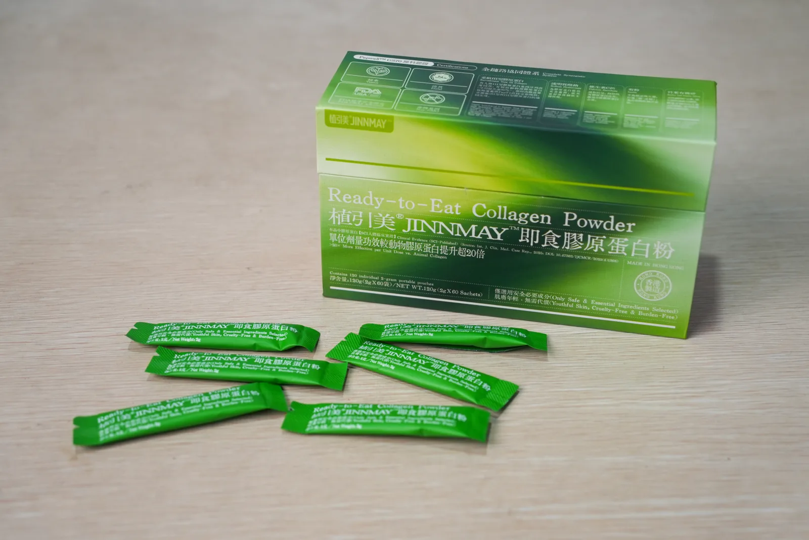 JINNMAY green product box and individual sachets on a table